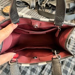 Small Coach hang bag. Never used it was too small for me. No tags.